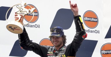 Italian rider Marco Bezzecchi celebrates winning the MotoGP Indian Grand Prix, Dankaur, India, Sept. 24m 2023. (EPA Photo)