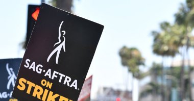 Strike signs are displayed as members of the Writers Guild of America and the Screen Actors Guild walk the picket line outside of Paramount Studios in Los Angeles, California, U.S., July 18, 2023. (AFP Photo)