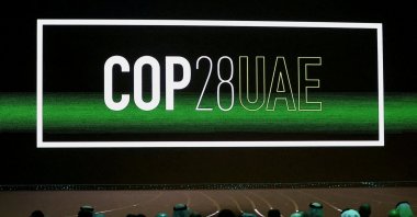 The &quot;COP28 UAE&quot; logo is displayed on the screen during the opening ceremony of Abu Dhabi Sustainability Week (ADSW) under the theme of &quot;United on Climate Action Toward COP28,&quot; in Abu Dhabi, UAE, Jan. 16, 2023. (Reuters Photo)
