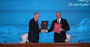 President Recep Tayyip Erdoğan shakes hands with Azerbaijani President Ilham Aliyev (R) during the ceremony in Nakchivan, Azerbaijan, Sept. 25, 2023. (AA Photo)