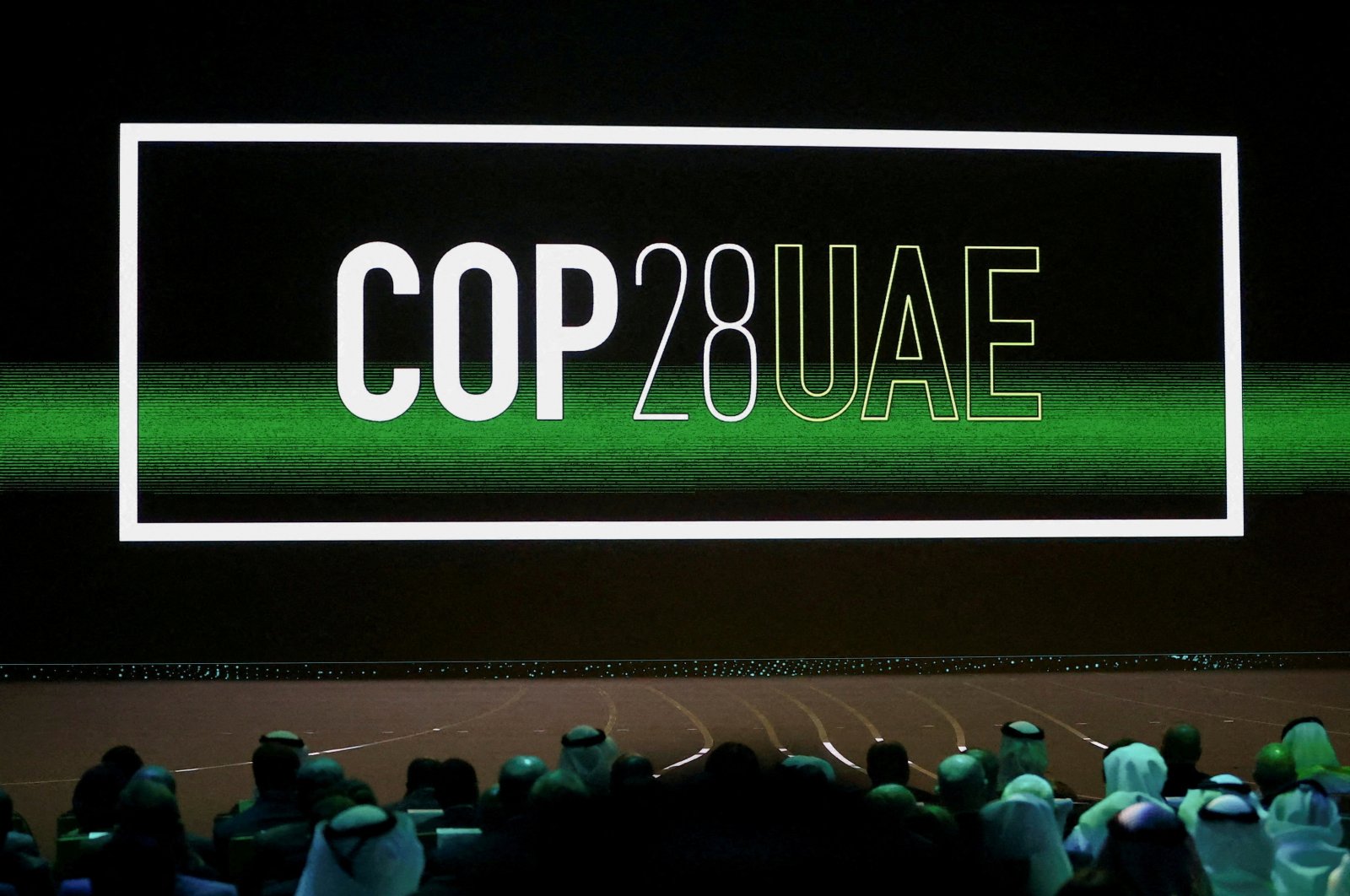The &quot;COP28 UAE&quot; logo is displayed on the screen during the opening ceremony of Abu Dhabi Sustainability Week (ADSW) under the theme of &quot;United on Climate Action Toward COP28,&quot; in Abu Dhabi, UAE, Jan. 16, 2023. (Reuters Photo)