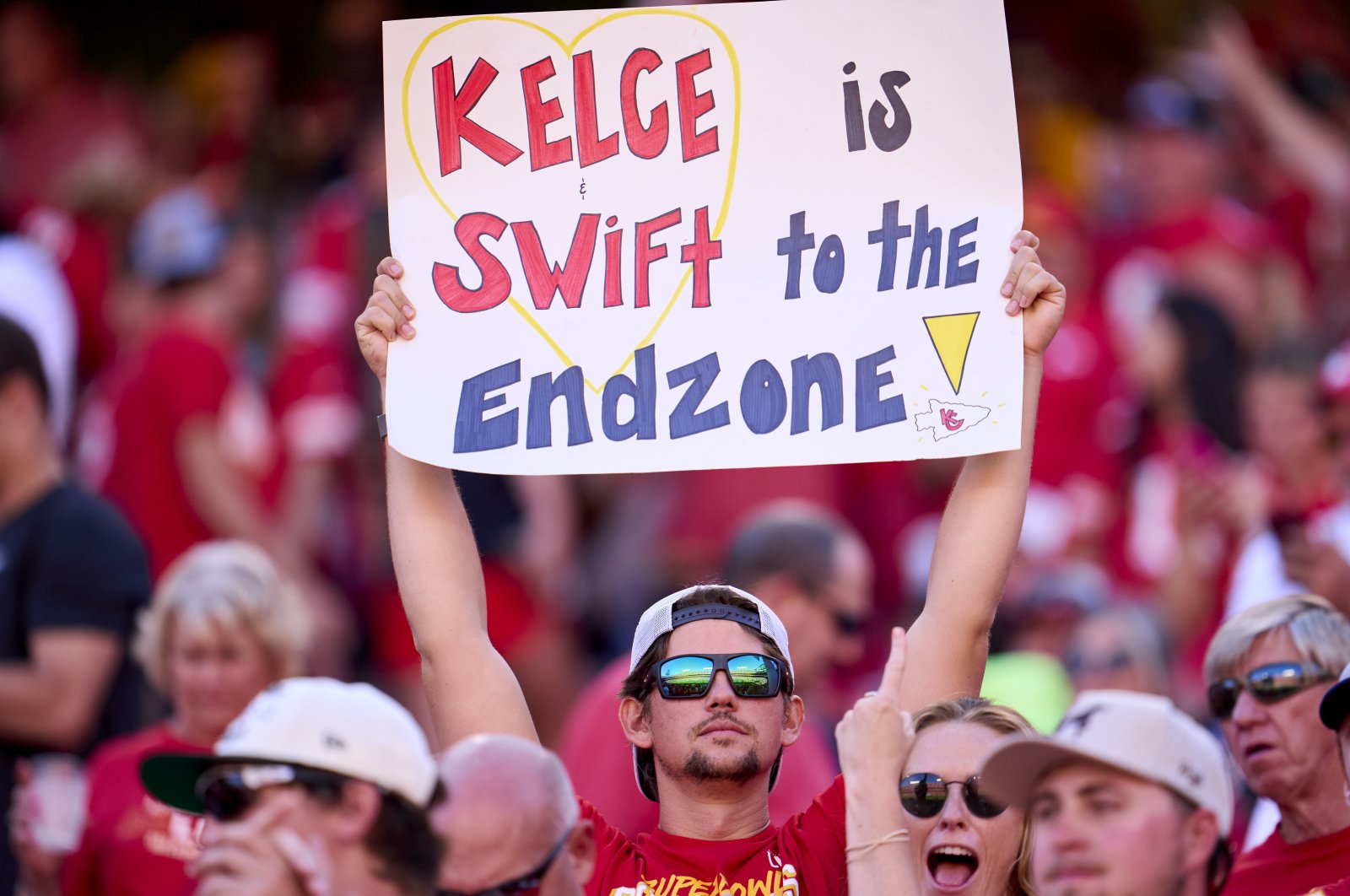 A fan holds a sign supporting Taylor Swift and Travis Kelce as the Kansas City Chiefs play the Chicago Bears during the first half at GEHA Field at Arrowhead Stadium, Missouri, U.S., Sept. 24, 2023. (Getty Images Photo)