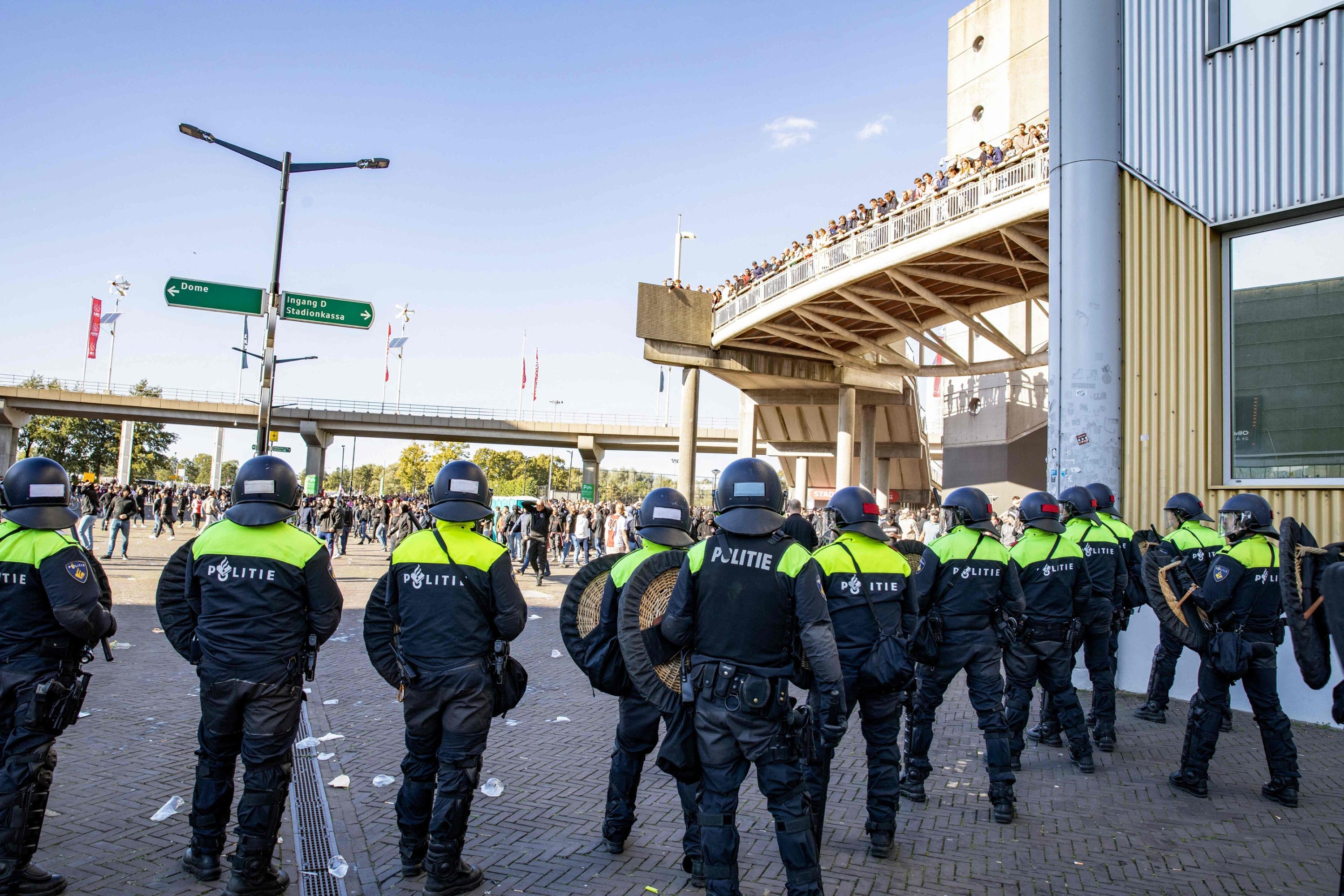 Police officers stand guard outside the Johan Cruijff Arena after the Dutch Eredivisie football match between Ajax Amsterdam and Feyenoord was suspended after fans threw flares onto the pitch, Amsterdam, Netherlands, Sept. 24, 2023. (AFP Photo)