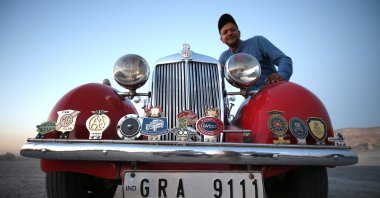 Indian businessperson Daman Thakore poses with his 1950 model classic car called "Lal Pari," Cappadocia, Türkiye, Sept. 26, 2023. (AA Photo)