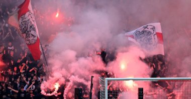 Ajax supporters set off fireworks during the Dutch Eredivisie match between Ajax Amsterdam and Feyenoord at Johan Cruyff Arena in Amsterdam, Netherlands, Sept. 24, 2023. (AFP Photo)