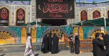 Pilgrims walk past the shrine of Imam Abbas, adjacent to the Imam Hussein shrine in Kerbala, Iraq, Sept. 29, 2020. (Reuters File Photo)