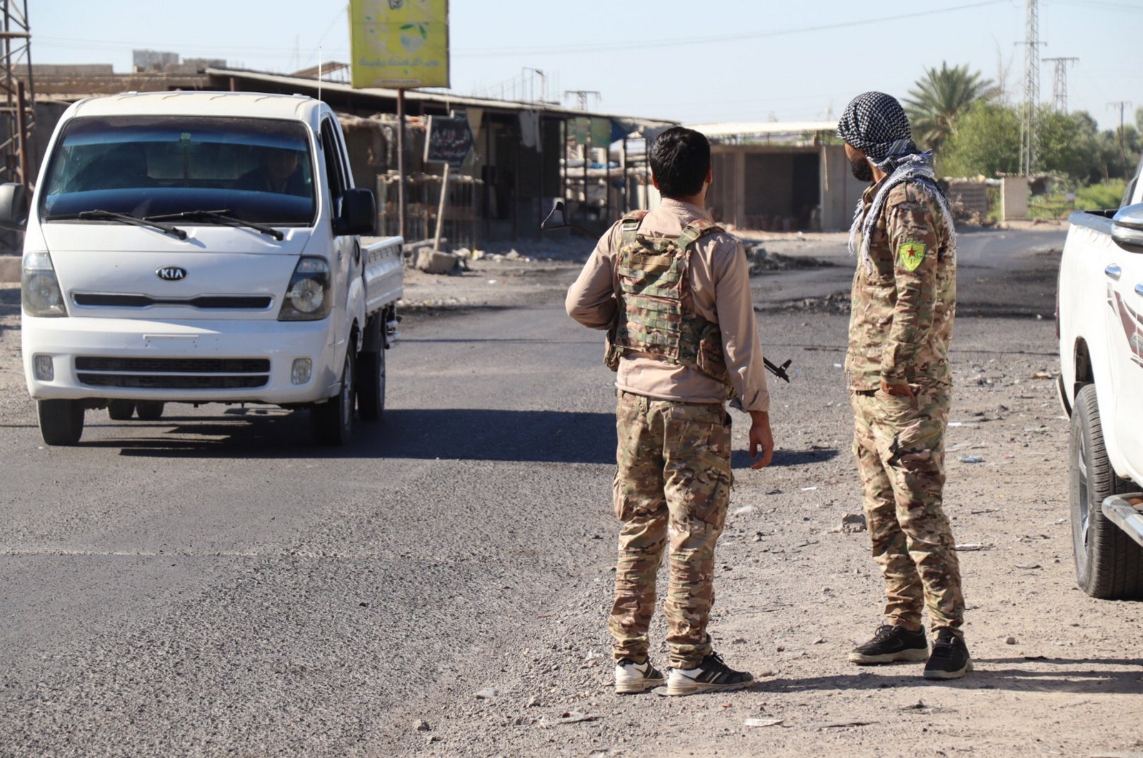 Militants of the U.S.-backed PKK/YPG terrorist group take up positions at Dhiban town in Deir el-Zour province, eastern Syria, Sept. 9, 2023. (EPA Photo)