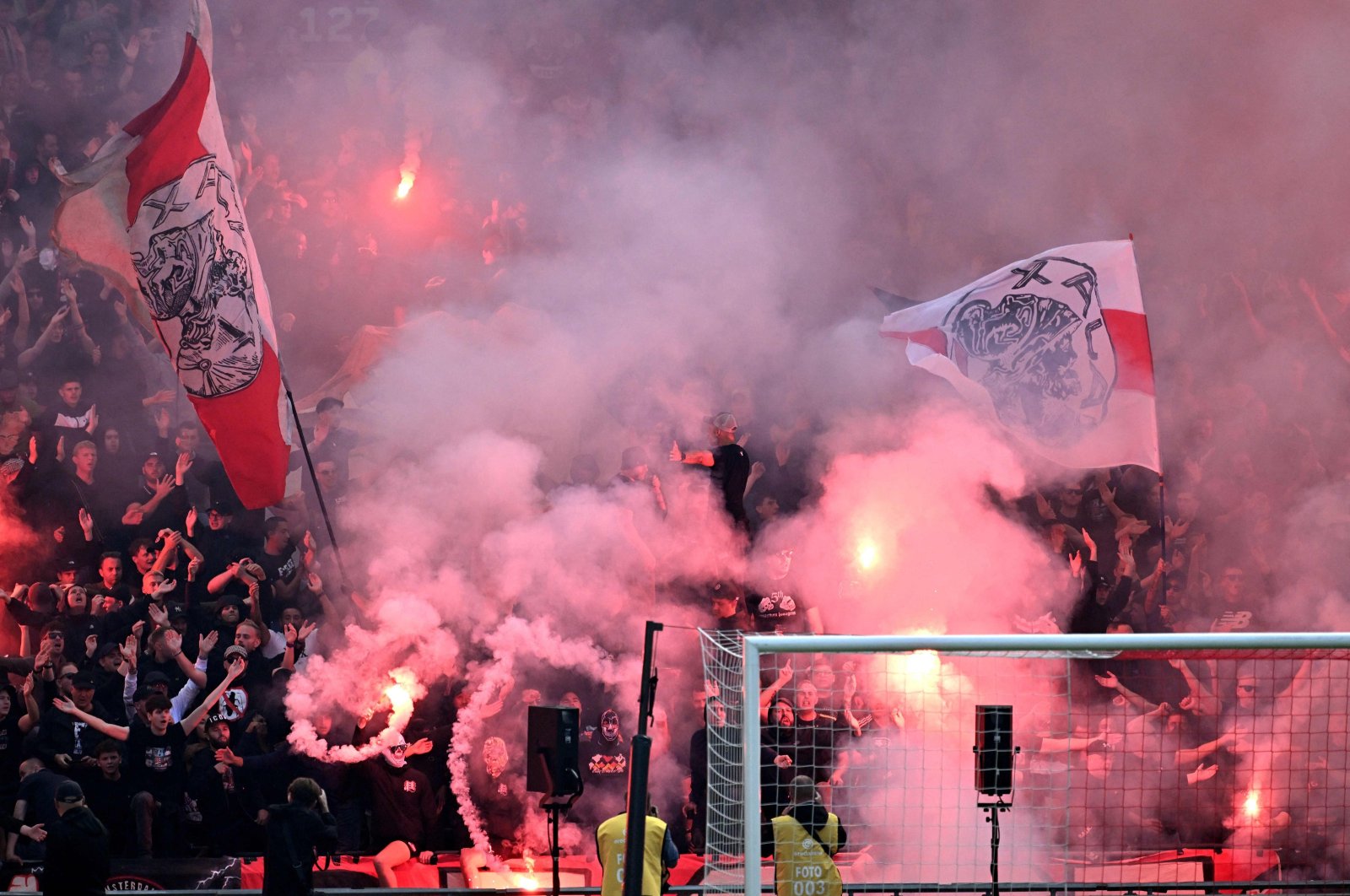 Ajax supporters set off fireworks during the Dutch Eredivisie match between Ajax Amsterdam and Feyenoord at Johan Cruyff Arena in Amsterdam, Netherlands, Sept. 24, 2023. (AFP Photo)