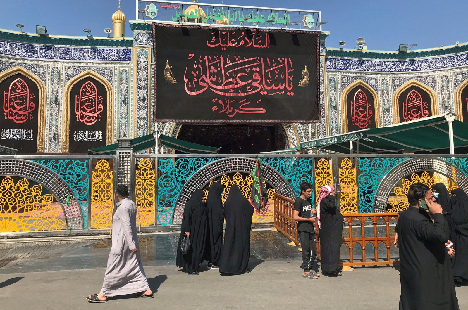 Pilgrims walk past the shrine of Imam Abbas, adjacent to the Imam Hussein shrine in Kerbala, Iraq, Sept. 29, 2020. (Reuters File Photo)
