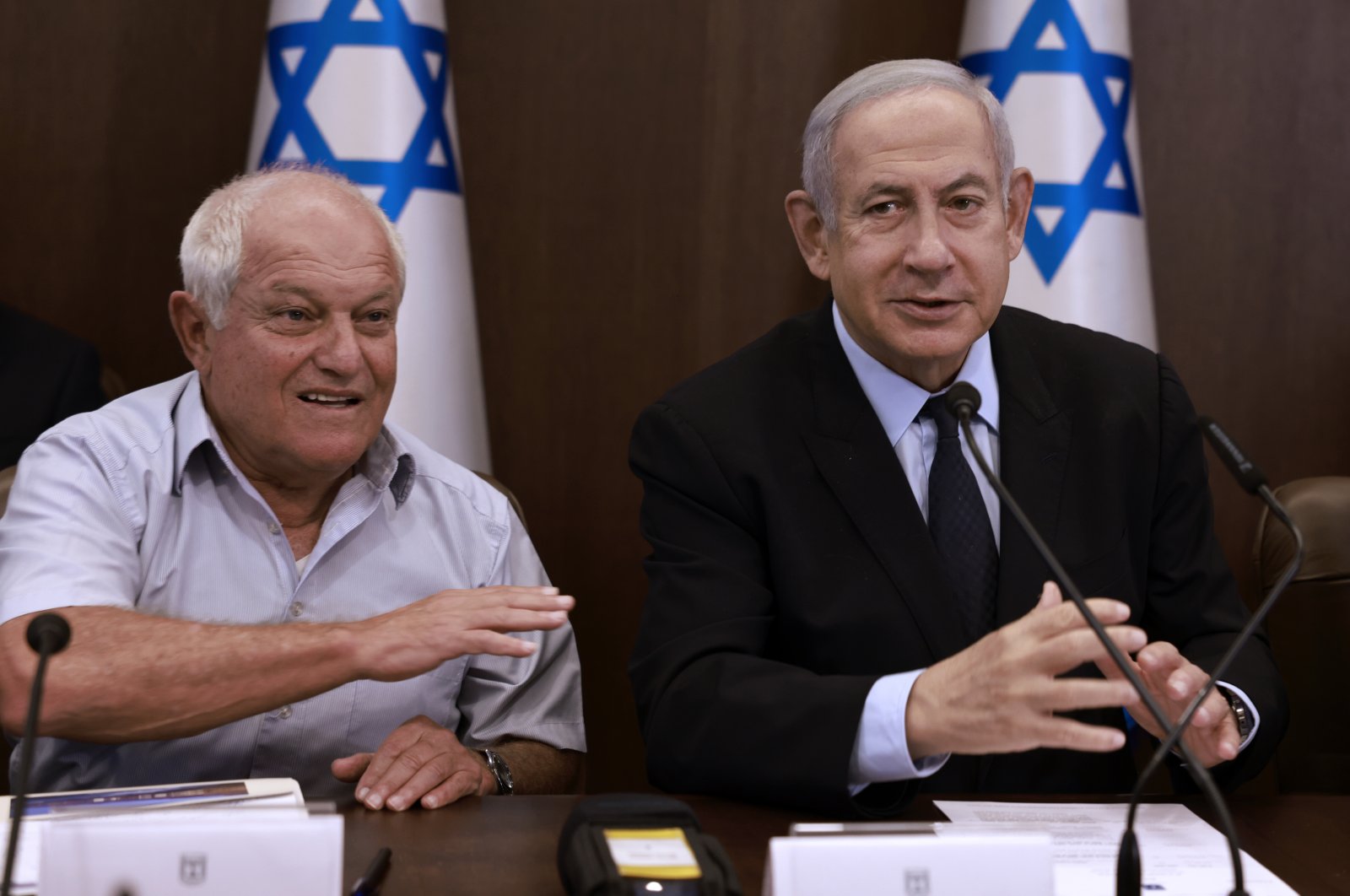 Israeli Prime Minister Benjamin Netanyahu, right, chairs a weekly cabinet meeting, flanked by Tourism Minister Haim Katz, at his office in Jerusalem Sunday, Aug. 27, 2023 (AP File Photo)