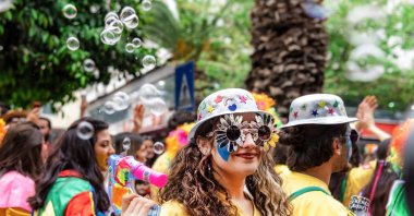 The clowns in the famous Orange Blossom Carnival parade with bubbles in the city of Adana, Türkiye. (Shutterstock Photo)