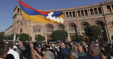 People gather at the Armenia government building to protest against Prime Minister Nikol Pashinyan in Yerevan, Armenia, Sept. 19, 2023. (AP Photo)