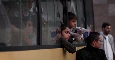 Refugees sit in a bus near a Red Cross registration centre in Goris, on Sept. 27, 2023. (AFP Photo)