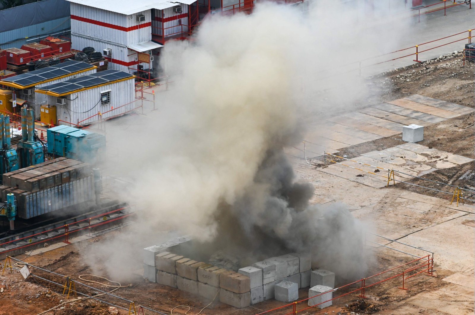 Smoke rises after a 100-kilogram World War II-era aerial bomb is detonated at a construction site in Singapore, Sept. 26, 2023. (AFP Photo)