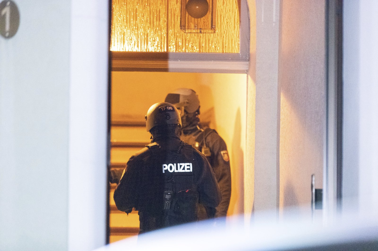 Police officers carry out a raid against a neo-Nazi group in Essen, Germany, Sept. 27, 2023. (AP Photo)