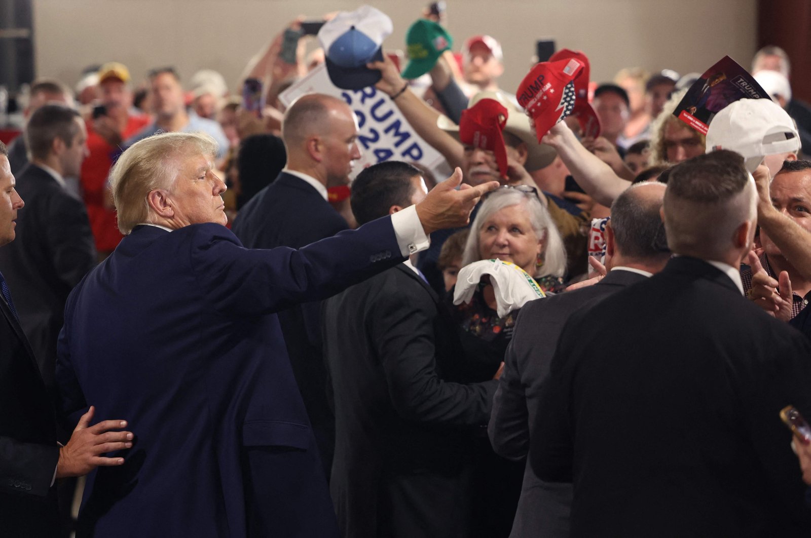 2024 Republican presidential candidate and former U.S. President Donald Trump greets guests following a &quot;Commit To Caucus&quot; rally at the Jackson County Fairgrounds in Maquoketa, Iowa, U.S., Sept. 20, 2023. (AFP Photo)