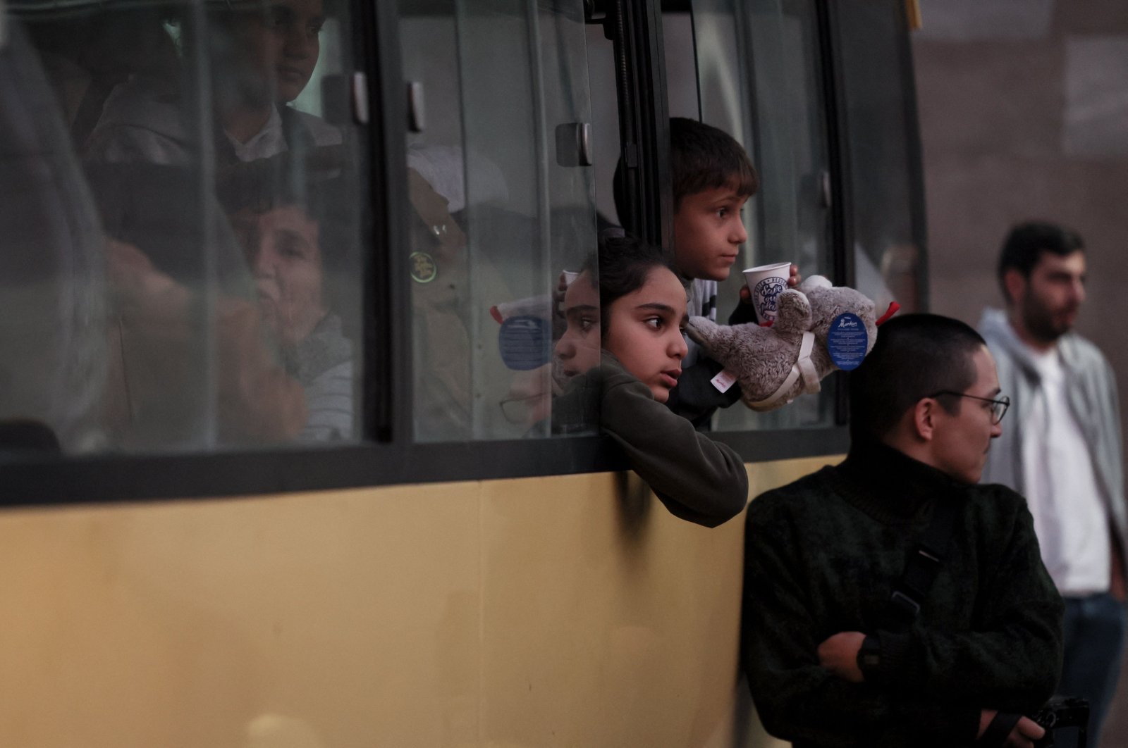 Refugees sit in a bus near a Red Cross registration centre in Goris, on Sept. 27, 2023. (AFP Photo)