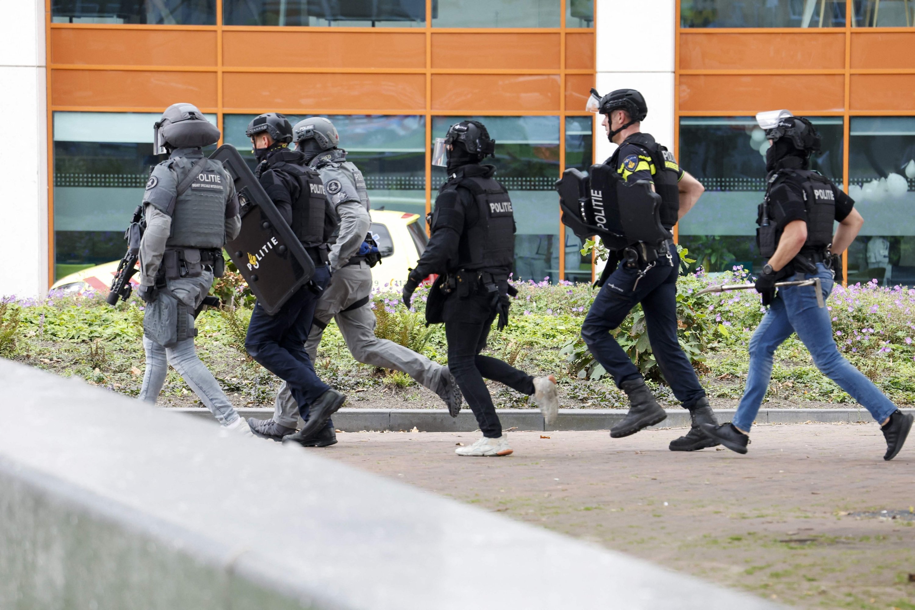 Netherlands&amp;amp;amp;amp;amp;amp;#039; police officers move toward the Erasmus University Medical Center (Erasmus MC), which was cordoned off after two reported shooting incidents, in Rotterdam, Netherlands, Sept. 28, 2023. (AFP Photo)