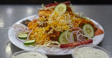 A plate of biryani is kept for customers at a restaurant in Karachi, Pakistan, Sept. 19, 2023. (AFP Photo)