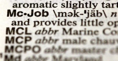The word "McJob" is seen in a Merriam-Webster's Collegiate Dictionary in a bookstore Illinois, U.S., Nov. 10, 2003. (Getty Images Photo)