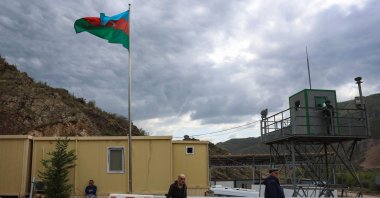 An Azerbaijani flag flies at a checkpoint, in Lachin, Karabakh, Azerbaijan, Sept. 26, 2023. (AFP Photo)