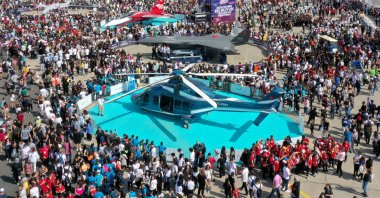 Crowds of visitors are seen surrounding the Gökbey helicopter during the newest Teknofest edition held in Izmir, western Türkiye, Sept. 28, 2023. (AA Photo)