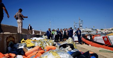 A handout photo made available by CHIGI PALACE PRESS OFFICE shows Italian Premier Giorgia Meloni, EU Commission President Ursula von der Leyen watching the dozens of small boats moored in front of the quay, on which hundreds of migrants have arrived in recent weeks, in Lampedusa, Italy, Sept. 17, 2023. (EPA File Photo)