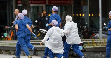 Medical staff leave the Erasmus University Medical Center (Erasmus MC), which has been cordoned off after two shooting incidents, in Rotterdam, Netherlands, Sept. 28, 2023. (EPA Photo)