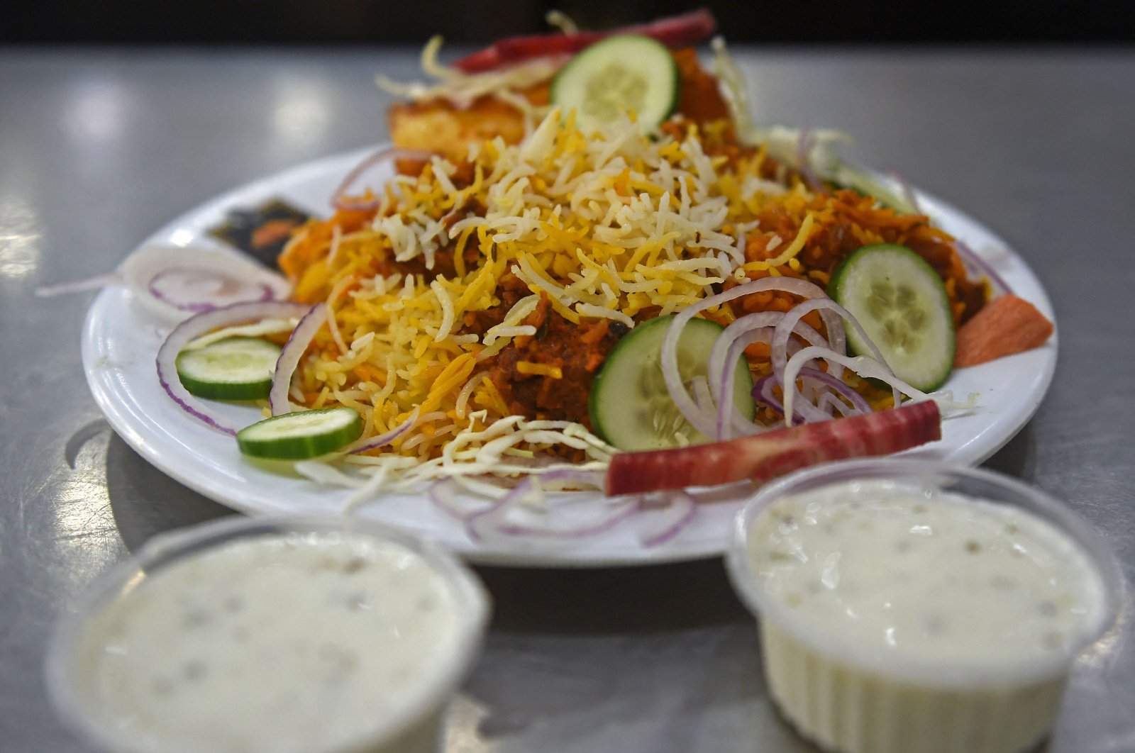 A plate of biryani is kept for customers at a restaurant in Karachi, Pakistan, Sept. 19, 2023. (AFP Photo)