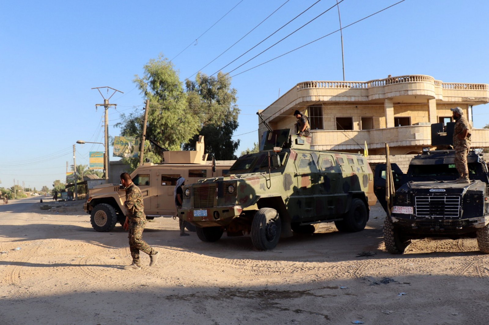 Militants of the U.S.-backed PKK/YPG terrorist group take up positions at Dhiban town in Deir el-Zour province, eastern Syria, Sept. 9, 2023. (EPA Photo)