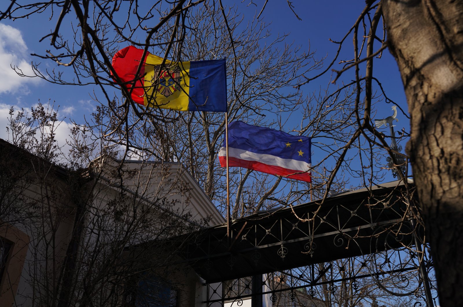 Moldovan and Gagauz flag fly on a building, Comrat, Moldova, March 17, 2022. (Getty Images Photo)