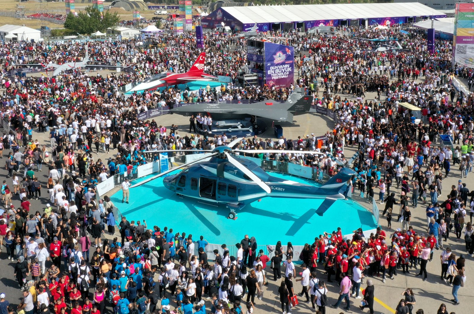 Crowds of visitors are seen surrounding the Gökbey helicopter during the newest Teknofest edition held in Izmir, western Türkiye, Sept. 28, 2023. (AA Photo)
