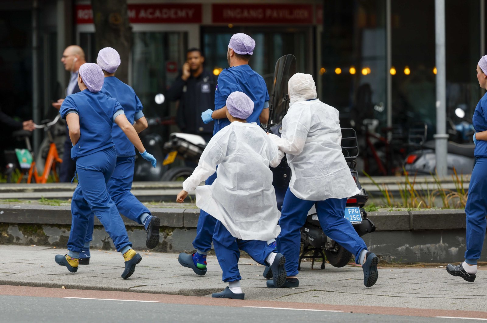 Medical staff leave the Erasmus University Medical Center (Erasmus MC), which has been cordoned off after two shooting incidents, in Rotterdam, Netherlands, Sept. 28, 2023. (EPA Photo)