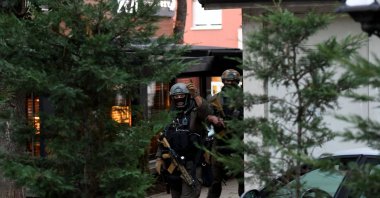 Kosovo police officers search a restaurant and building in northern Serb-dominated part of the ethnically divided town of Mitrovica on Sept. 29, 2023. (AFP Photo)