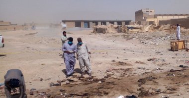 Security officials examine the site of a suicide bomb attack targeting a procession marking the birth of  Prophet Mohammed in Mastung district in Baluchistan province in Pakistan on Sept. 29, 2023. (AFP Photo)