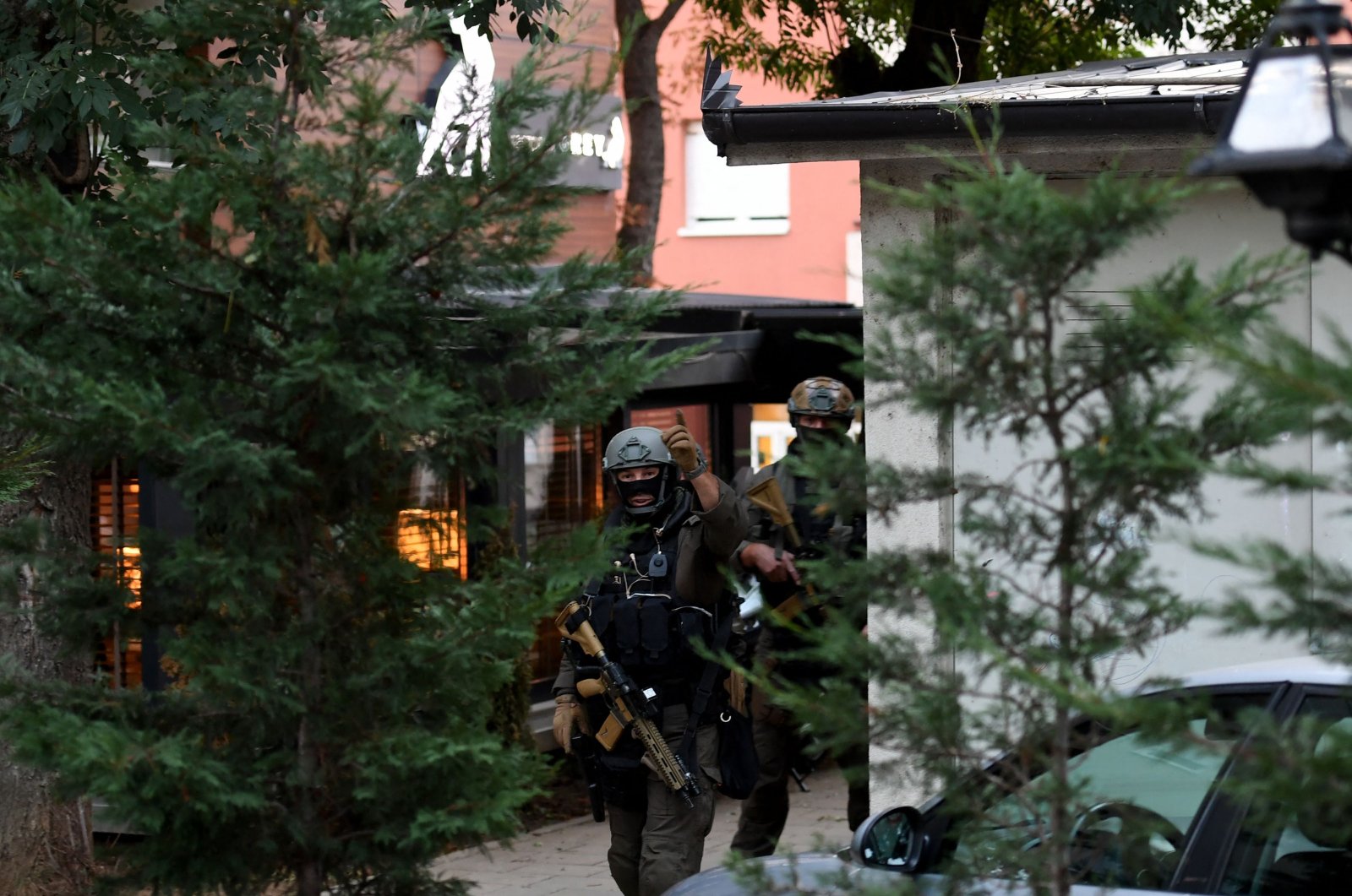 Kosovo police officers search a restaurant and building in northern Serb-dominated part of the ethnically divided town of Mitrovica on Sept. 29, 2023. (AFP Photo)