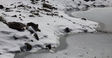 Melting ice of a small pool of the Schneeferner Glacier below Germany's highest mountain Zugspitze, near Garmisch-Partenkirchen, Germany, Sept. 26, 2023. (EPA Photo)