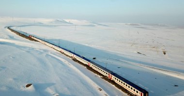An aerial view of the Eastern Express train passing through a snowy field near Kars, Türkiye, Jan. 9, 2022. (AFP Photo)