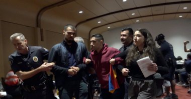 Security guards remove attackers from the event venue, Los Angeles, California, U.S., Sept. 29, 2023. (AA Photo)