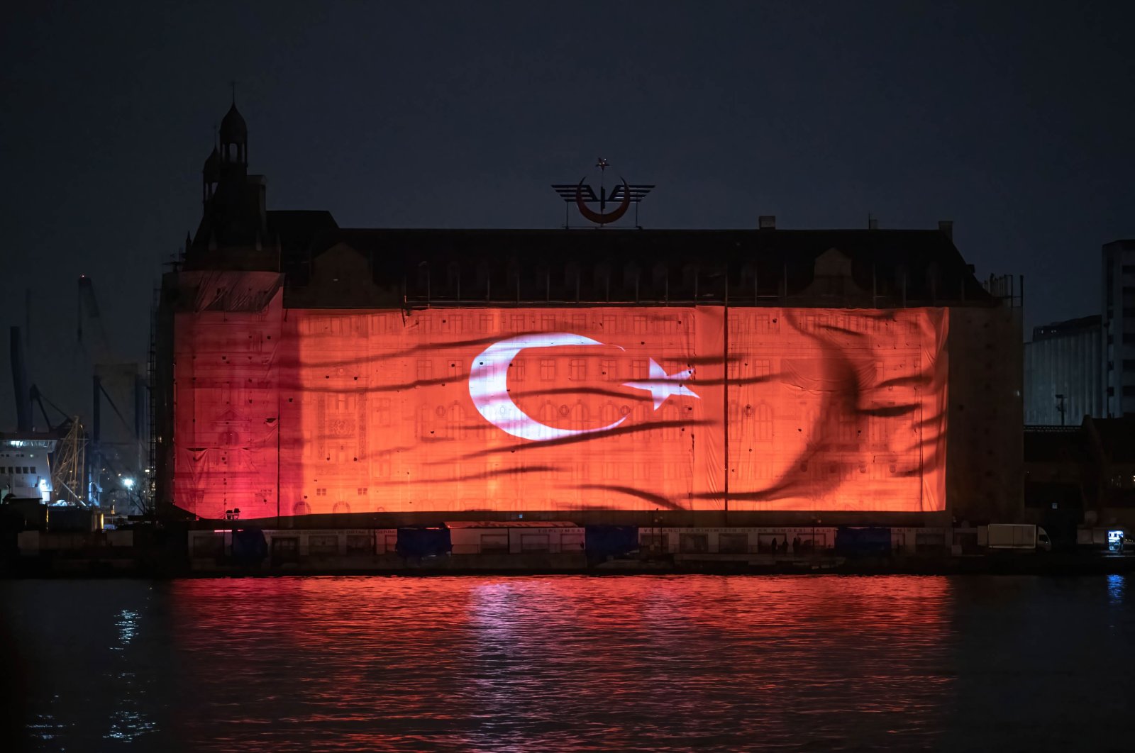The Turkish flag is projected on the historic Haydarpaşa Station, Istanbul, Türkiye, April 20, 2023. (Getty Images Photo)
