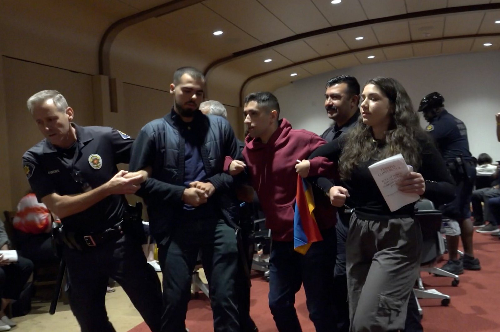 Security guards remove attackers from the event venue, Los Angeles, California, U.S., Sept. 29, 2023. (AA Photo)