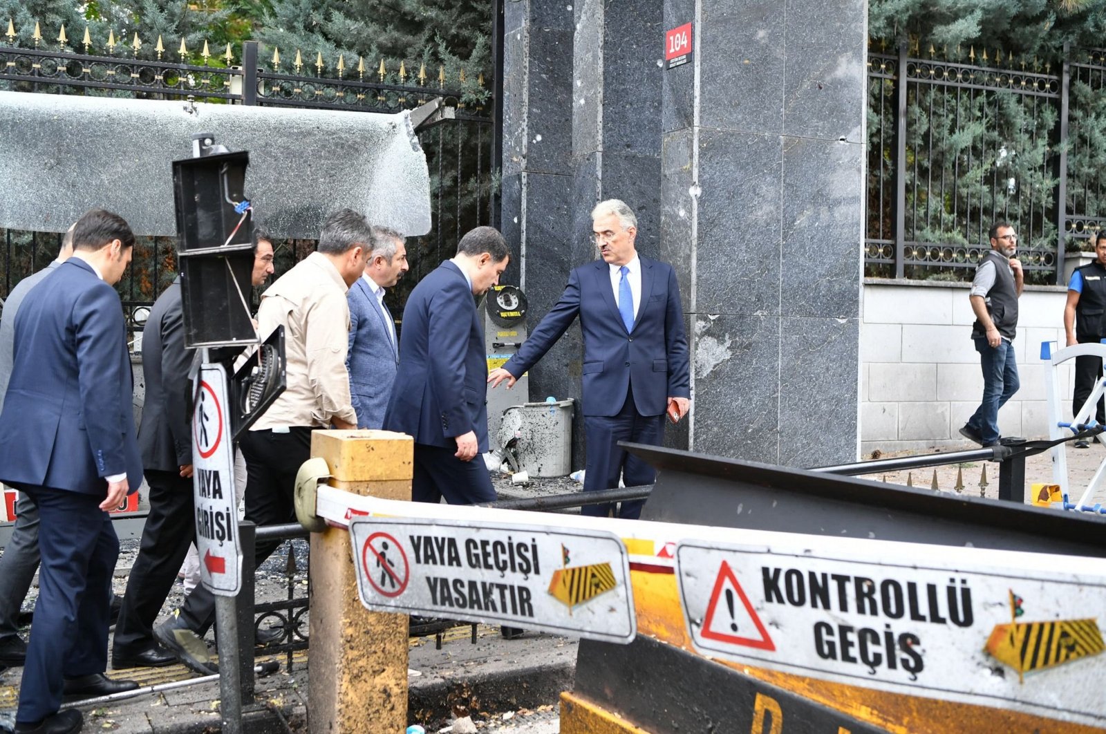 Governor Vasip Şahin along with other officials inspect the scene outside the Ministry of Interior, Ankara, Türkiye, Oct. 2, 2023. (AA Photo)