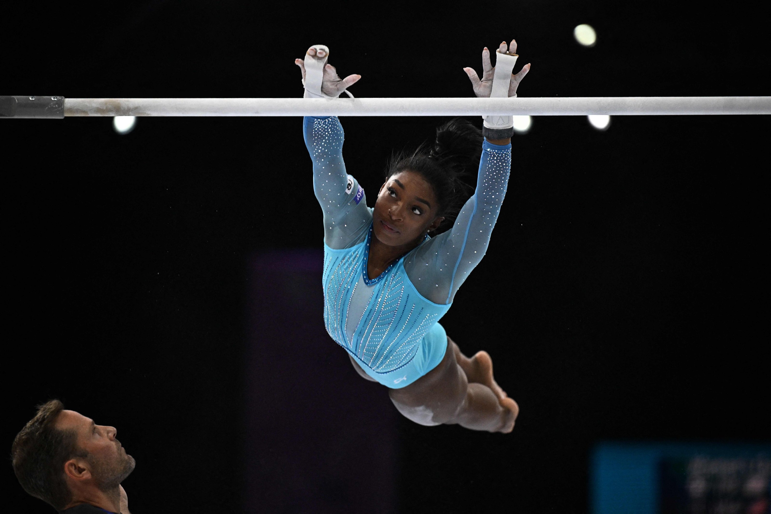 TOPSHOT - US&#039; Simone Biles competes in the uneven bars during the women&#039;s qualifying session at the 52nd FIG Artistic Gymnastics World Championships, Antwerp, Belgium, Oct. 1, 2023. (AFP Photo)