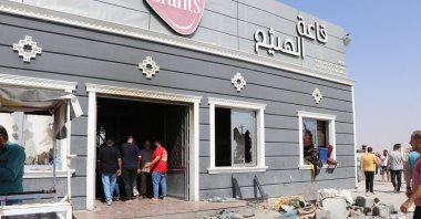 Iraqis inspect the scene the morning after a fire broke out at a wedding hall in Hamdaniya town, Iraq, Sept. 27, 2023. (EPA Photo)