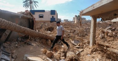 A man walks on the rubble of his flood-destroyed house in Derna, Libya, Sept. 28, 2023. (Reuters Photo)