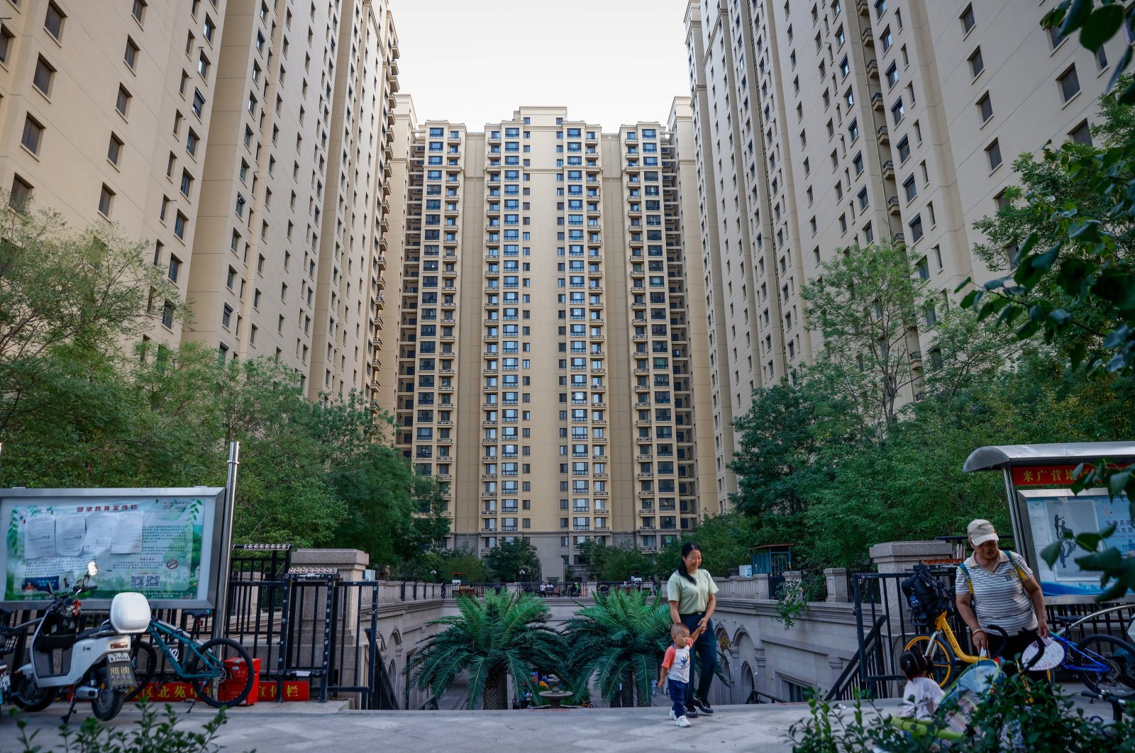 People walk along a China Evergrande residential area in Beijing, China, Sept. 18, 2023. (EPA Photo)