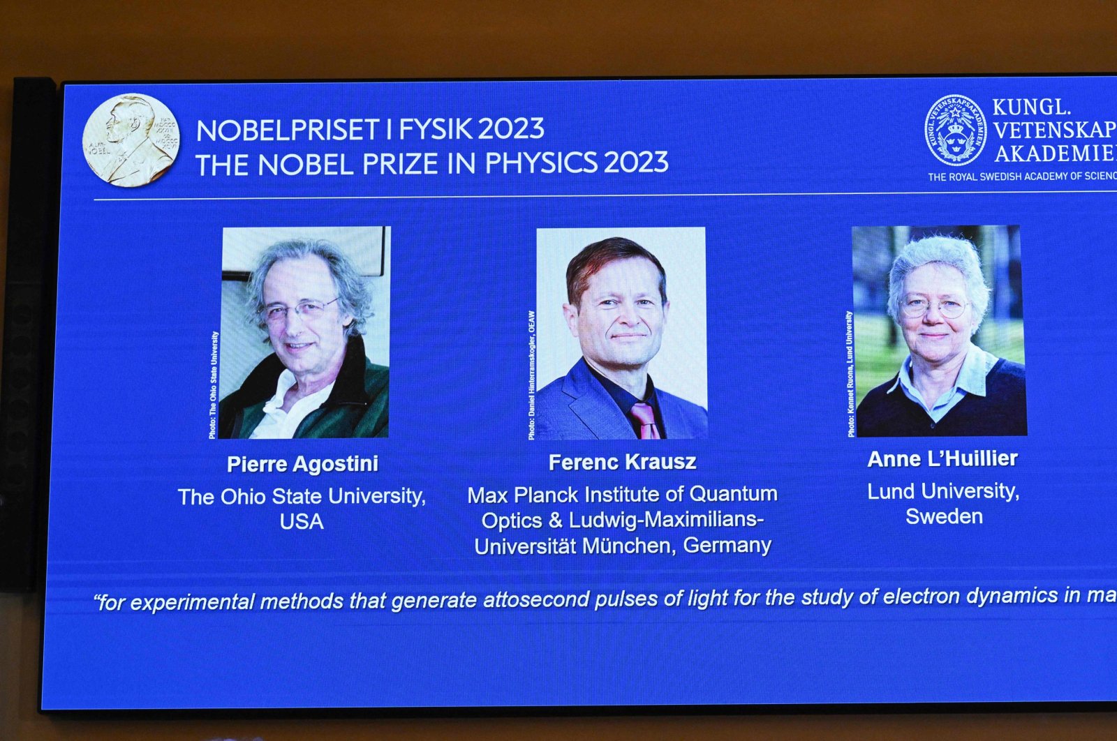 (L-R) A screen shows this year&#039;s laureates U.S.-based physicist Pierre Agostini, Hungarian-Austrian physicist and French physicist Anne Luillier during the announcement of the winners of the 2023 Nobel Prize in Physics at Royal Swedish Academy of Sciences in Stockholm, Sweden, Oct. 3, 2023. (AFP Photo)