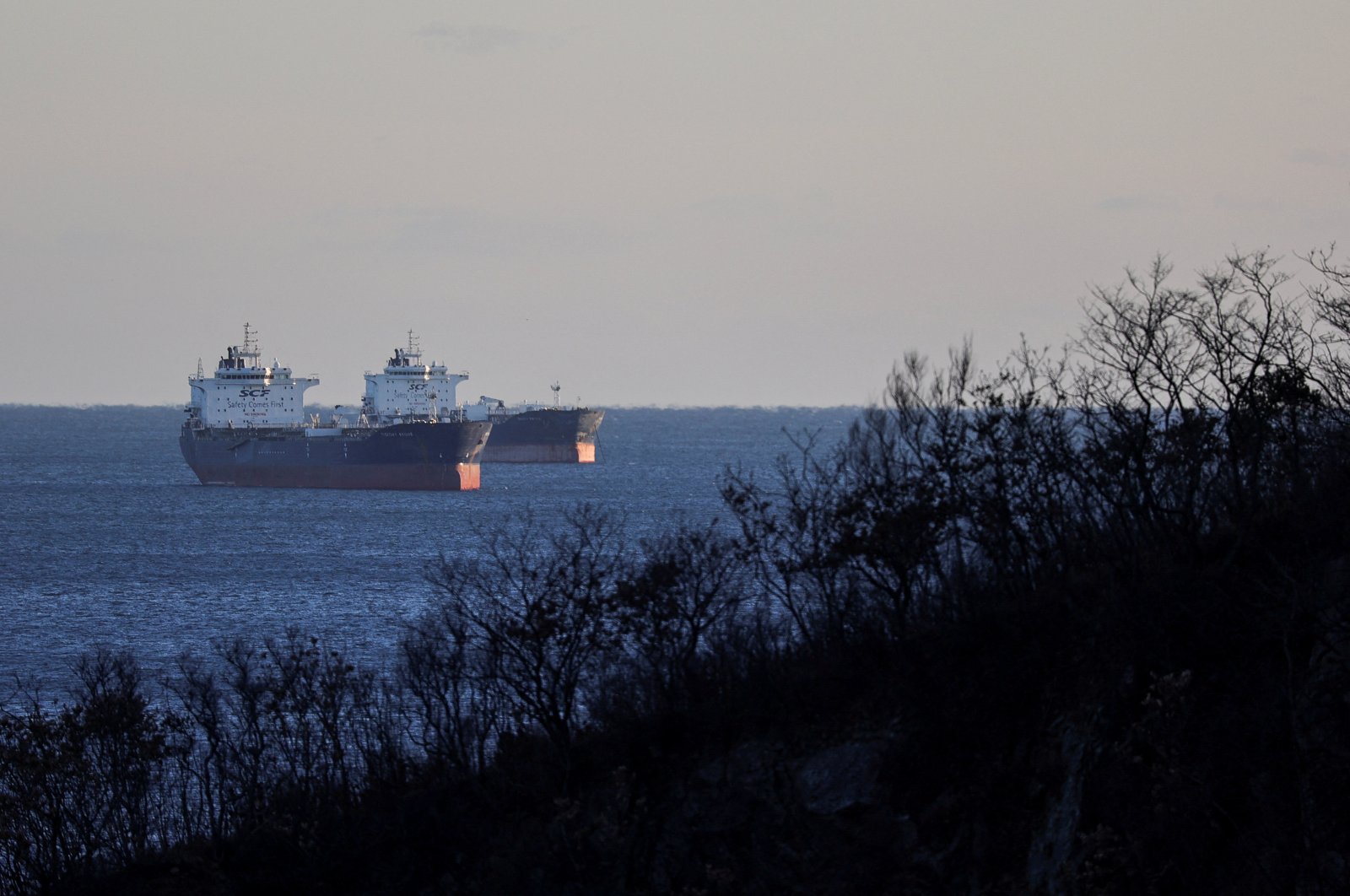 Crude oil tankers, including the Troitsky Bridge vessel, lie at anchor in Nakhodka Bay near the port city of Nakhodka, Russia, Dec. 4, 2022. (Reuters Photo)