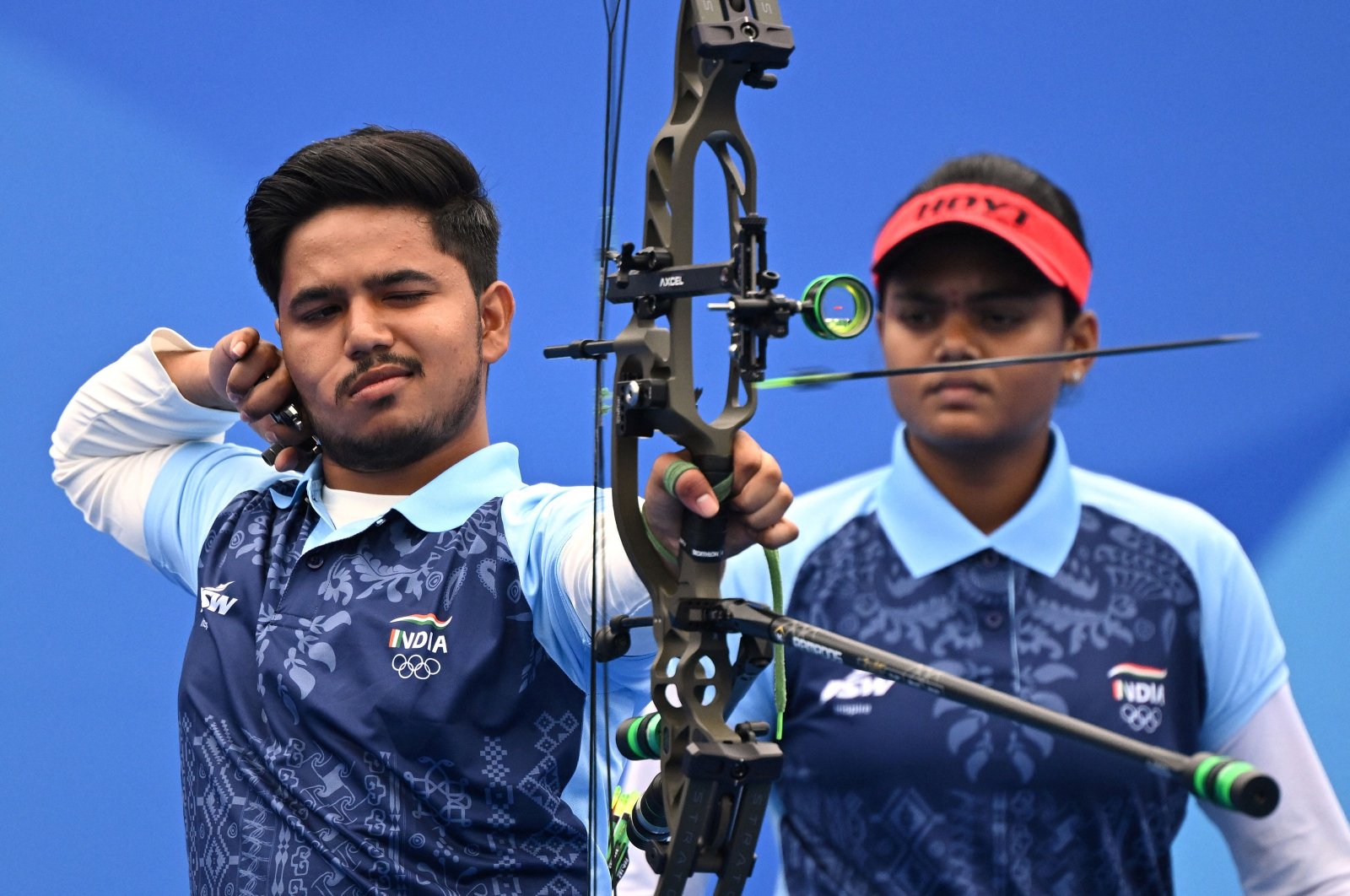India&#039;s Jyothi Surekha Vennam (R) and Ojas Pravin Deotale (L) compete against Malaysia in the archery compound mixed team quarter-final match during the 2022 Asian Games, Hangzhou, China, Oct. 4, 2023. (AFP Photo)