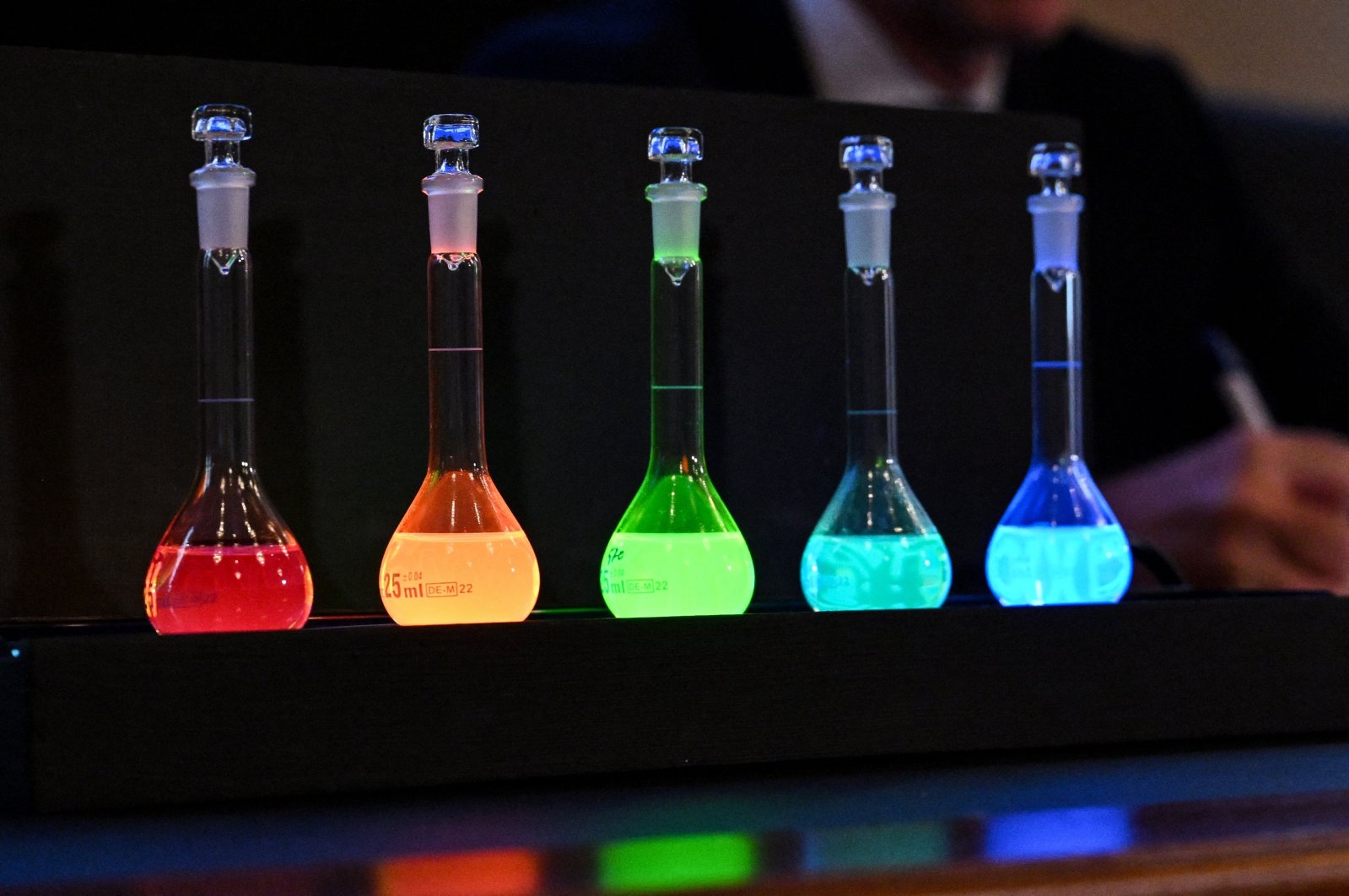 Laboratory flasks are used for explanation during the announcement of the winners of the 2023 Nobel Prize in chemistry at the Royal Swedish Academy of Sciences in Stockholm on Oct. 4, 2023. (AFP Photo)